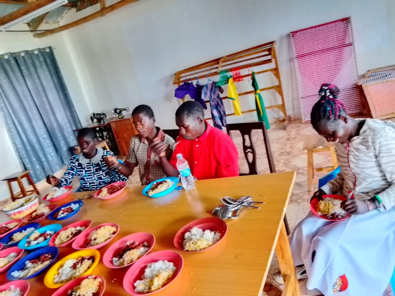 Students eating a meal at Kujenga School
