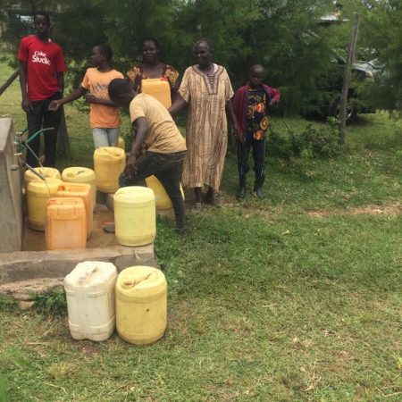 Kujenga community members are collecting fresh water from the newly built taps.